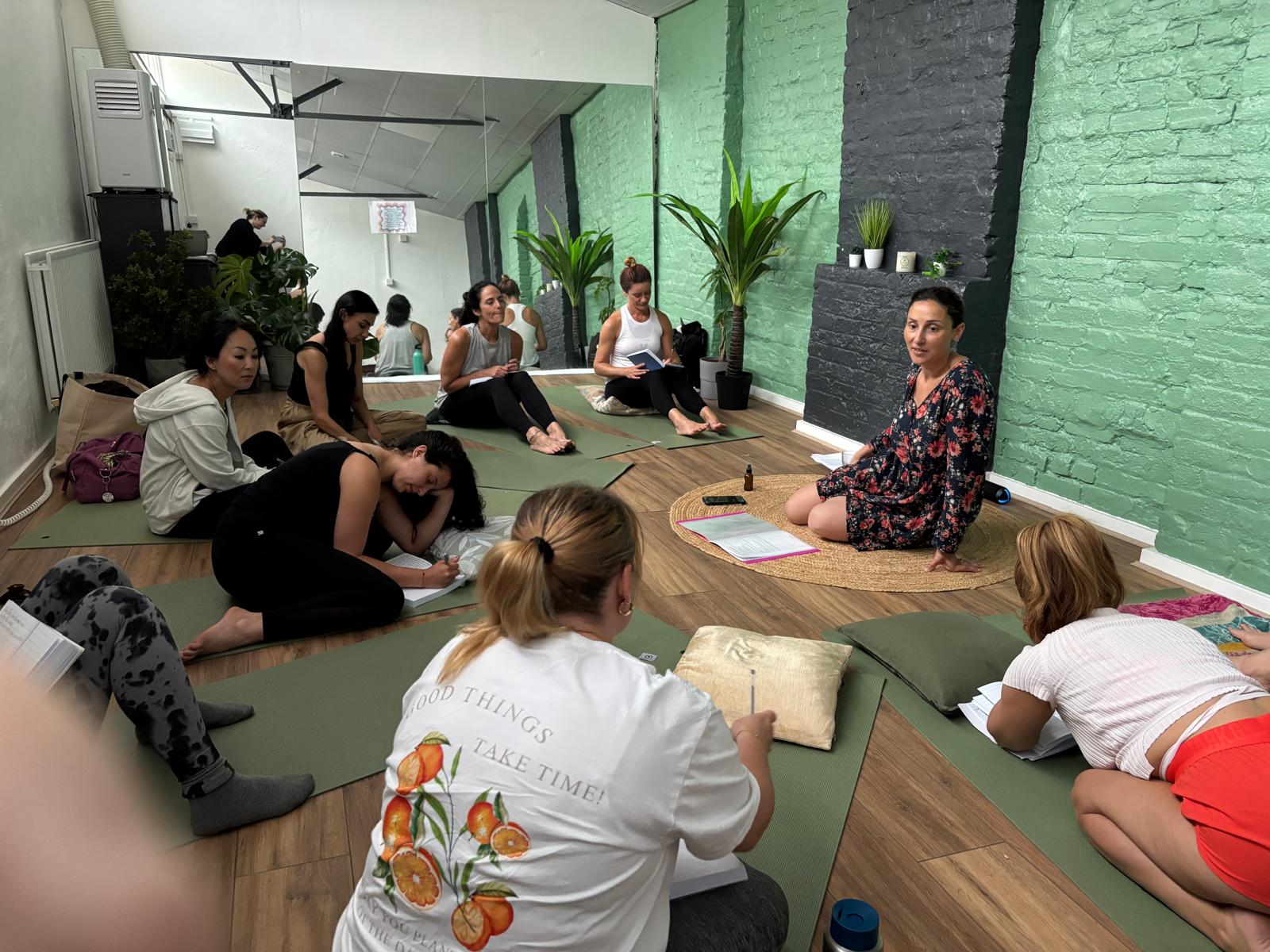 Women gathered in a supportive circle at a previous Reconnect and Rise retreat