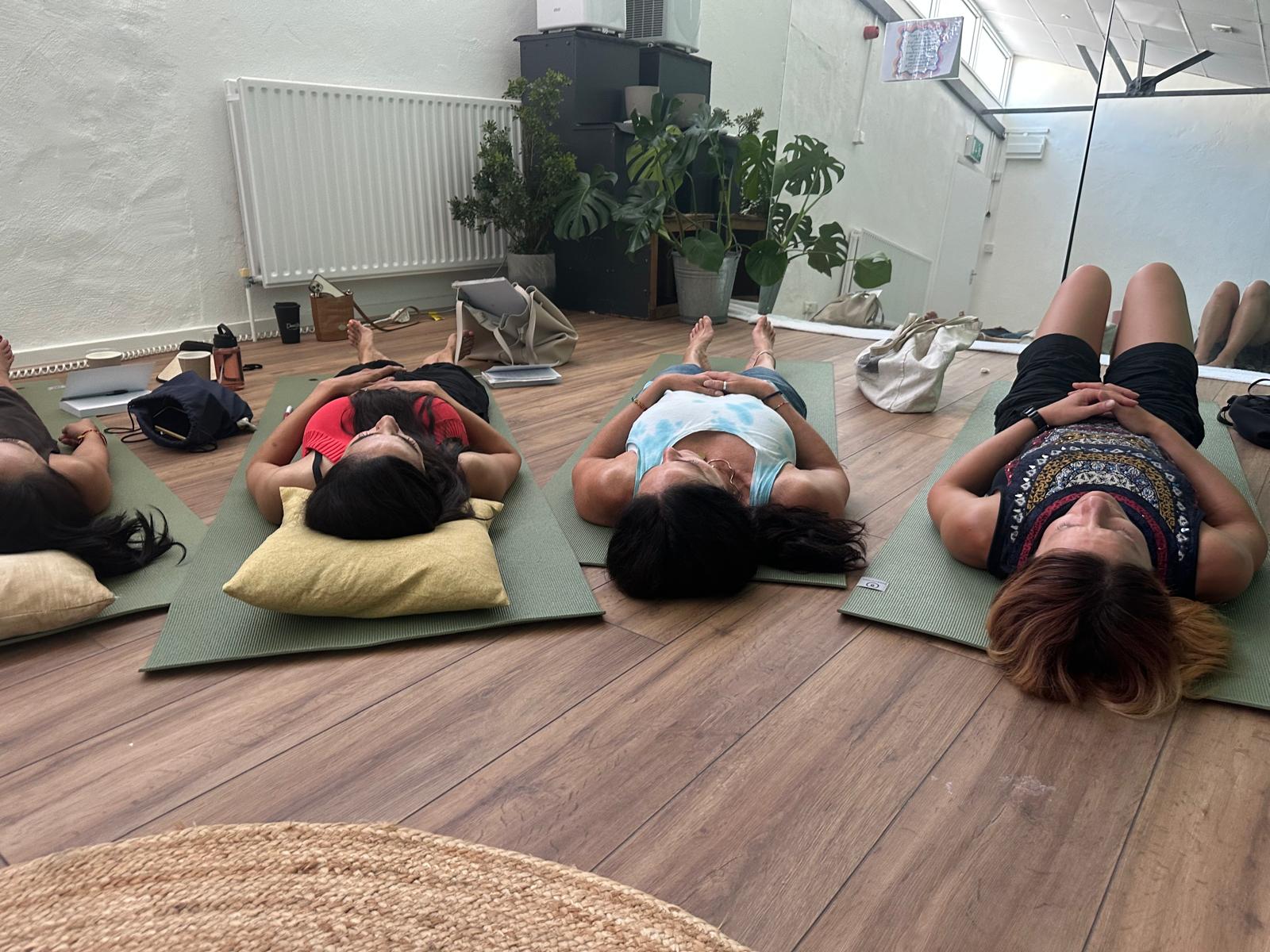 Women resting during a group hypnosis session